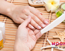 woman-nail-salon-receiving-manicure-by-beautician-beauty-treatment-concept.jpg